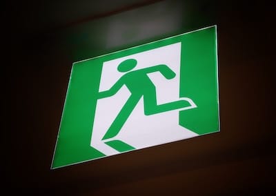 Exit sign - running man in green