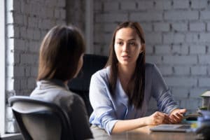 Image of two businesswomen talking