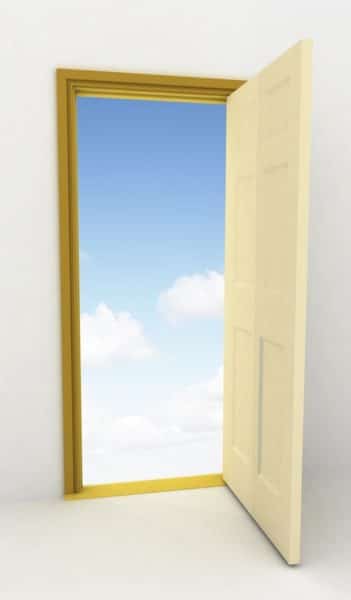 image of open door with blue sky beyond