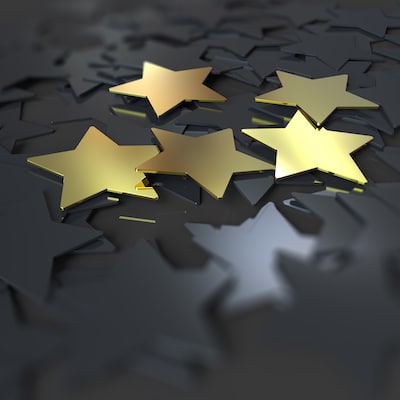 5 golden stars on dark background