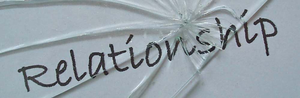 Broken glass over word: relationship