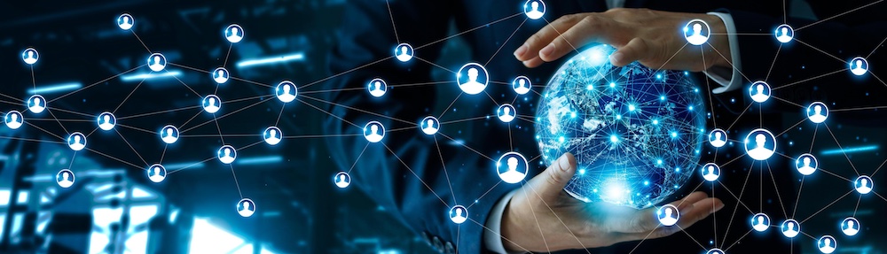 Businessman holding a globe showing connections to many people