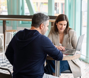 Image of a business meeting between a man and a woman