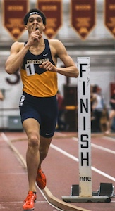 Image of a runner crossing the finish line